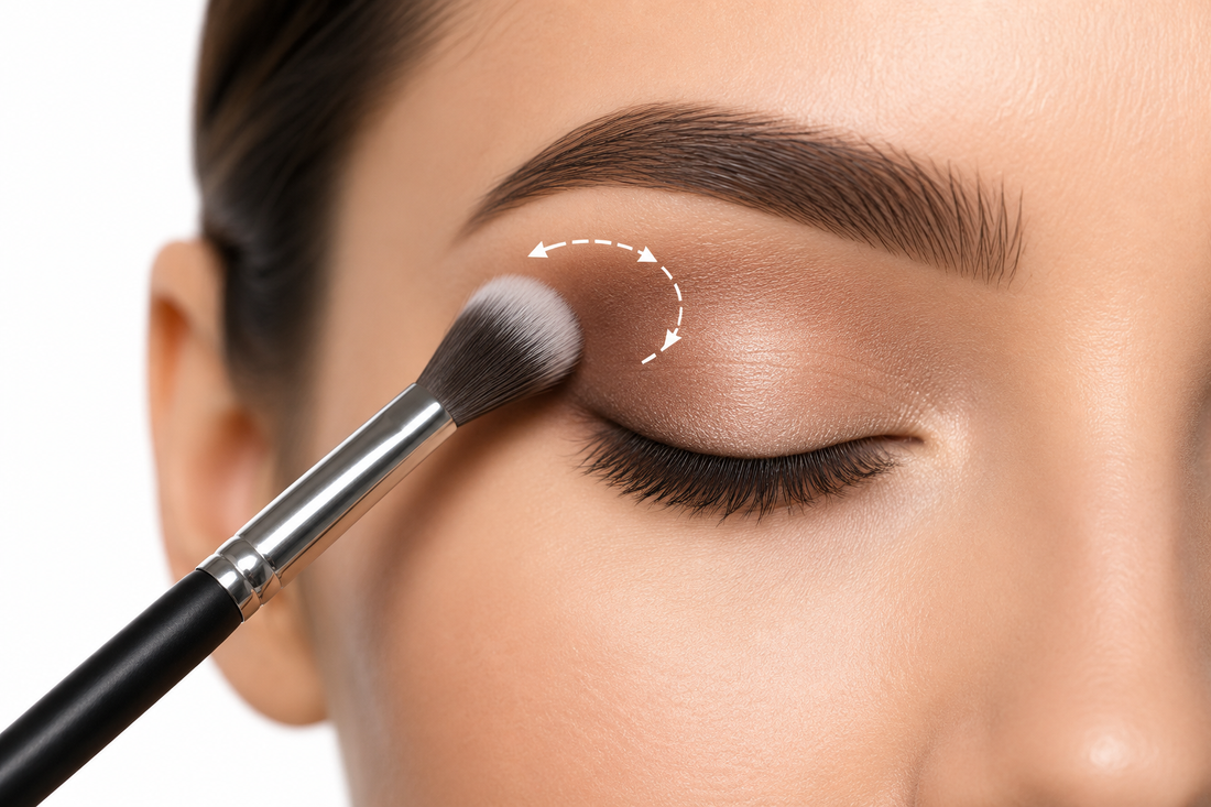 Blending eyeshadow using soft circular motions with a fluffy brush